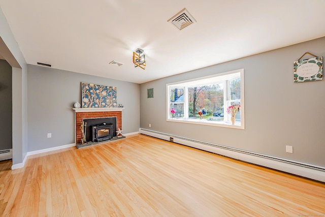 106 Lorraine Ter, Middletown, CT 06457 - unfurnished living room with visible vents, baseboards, a baseboard heating unit, and light wood-style floors