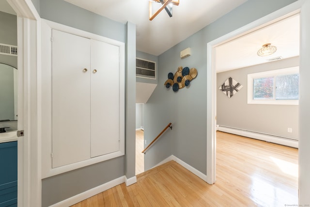 106 Lorraine Ter, Middletown, CT 06457 - hall featuring an upstairs landing, visible vents, light wood-style flooring, baseboards, and baseboard heating