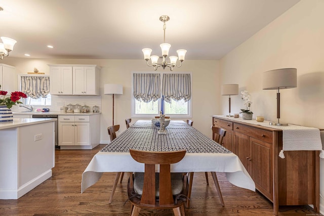 dining space featuring dark wood finished floors, recessed lighting, a notable chandelier, and a healthy amount of sunlight