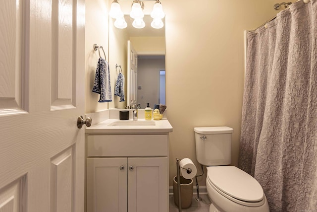 bathroom with vanity, toilet, and a shower with shower curtain