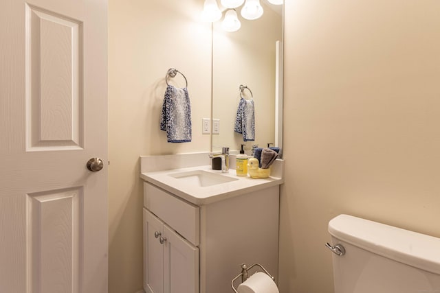 bathroom with toilet and vanity