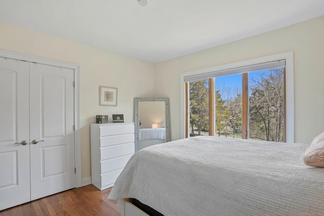 bedroom with wood finished floors