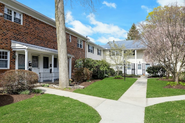view of property's community with a yard