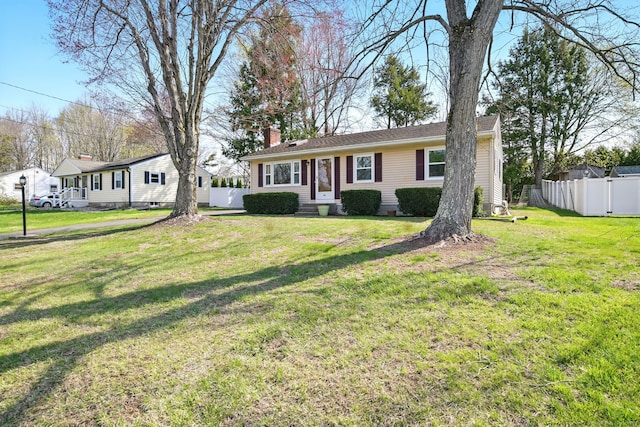 94 Maple Ridge Dr, Somers, CT 06071 - ranch-style house with a front lawn, a chimney, and fence
