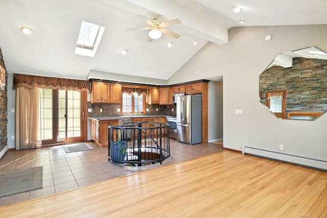 94 Maple Ridge Dr, Somers, CT 06071 - kitchen featuring freestanding refrigerator, decorative backsplash, brown cabinets, ceiling fan, and a baseboard radiator