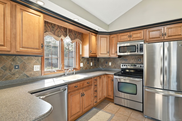 94 Maple Ridge Dr, Somers, CT 06071 - kitchen with stainless steel appliances, a sink, tasteful backsplash, vaulted ceiling, and light tile patterned floors