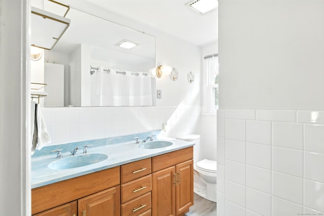 94 Maple Ridge Dr, Somers, CT 06071 - bathroom featuring tile walls, a sink, double vanity, and toilet