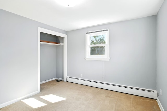94 Maple Ridge Dr, Somers, CT 06071 - unfurnished bedroom with a baseboard heating unit, carpet floors, a closet, and baseboards