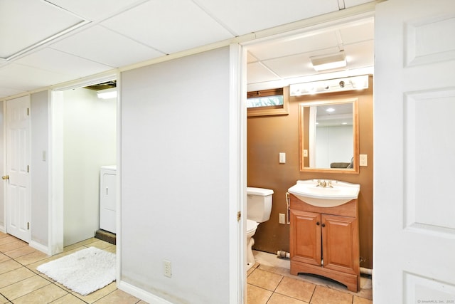 94 Maple Ridge Dr, Somers, CT 06071 - half bath featuring vanity, toilet, washer / dryer, and tile patterned flooring