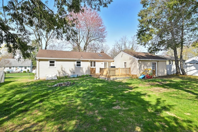 94 Maple Ridge Dr, Somers, CT 06071 - back of house with a wooden deck, a lawn, and an outdoor structure