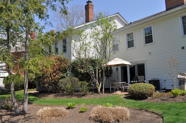 1 E Hayestown Rd Unit 142, Danbury, CT 06811 - rear view of property with a patio, central air condition unit, and a chimney