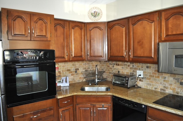 1 E Hayestown Rd Unit 142, Danbury, CT 06811 - kitchen with a toaster, light stone countertops, tasteful backsplash, a sink, and black appliances