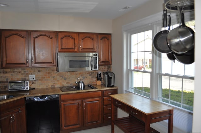 1 E Hayestown Rd Unit 142, Danbury, CT 06811 - kitchen with light countertops, decorative backsplash, a toaster, visible vents, and black appliances
