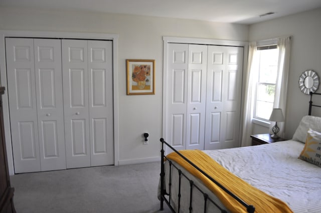 1 E Hayestown Rd Unit 142, Danbury, CT 06811 - carpeted bedroom with baseboards, two closets, and visible vents