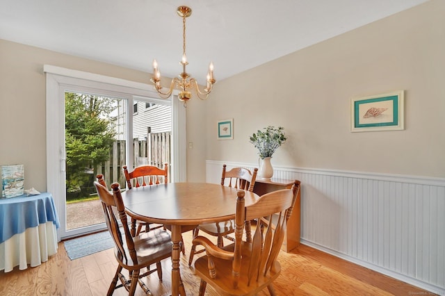 dining room featuring an inviting chandelier and light wood finished floors