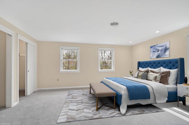 carpeted bedroom with recessed lighting, baseboards, and visible vents