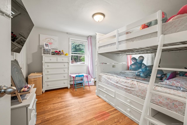 bedroom featuring light wood-style floors