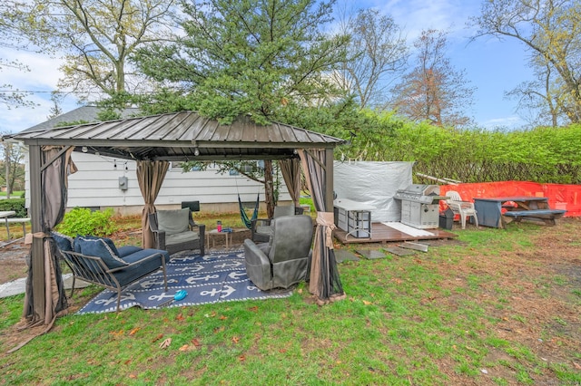 view of yard featuring fence, a gazebo, outdoor lounge area, and a patio area