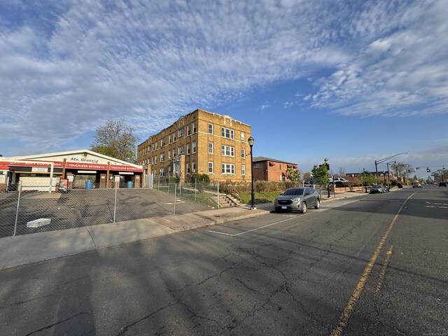 913 Wethersfield Ave, Hartford, CT 06114 - view of building exterior with uncovered parking