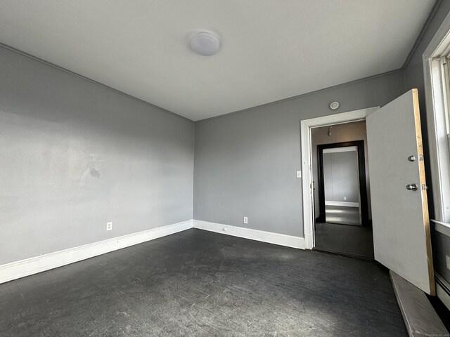 913 Wethersfield Ave, Hartford, CT 06114 - empty room with baseboards and dark colored carpet