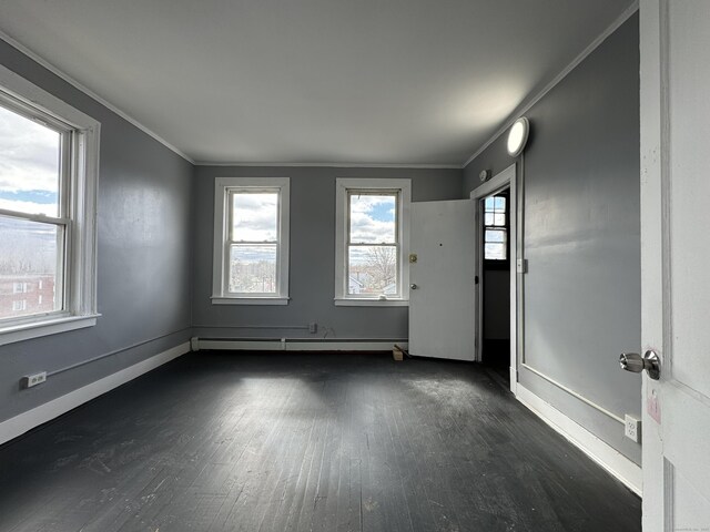 913 Wethersfield Ave, Hartford, CT 06114 - unfurnished room featuring dark wood-style floors, a baseboard radiator, baseboards, and ornamental molding