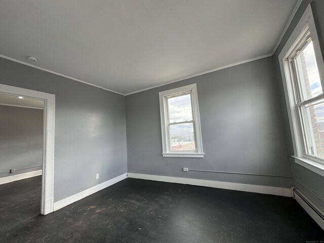 913 Wethersfield Ave, Hartford, CT 06114 - spare room with baseboard heating, baseboards, crown molding, and a smoke detector