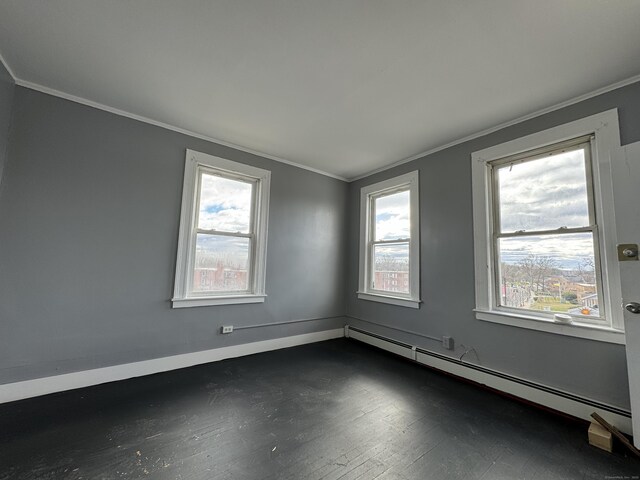 913 Wethersfield Ave, Hartford, CT 06114 - unfurnished room featuring a baseboard radiator, ornamental molding, dark wood finished floors, and baseboards