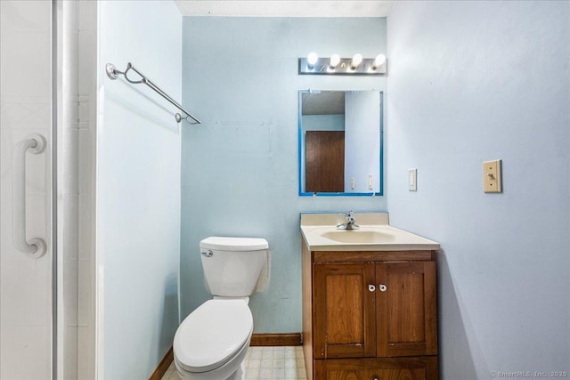 bathroom with toilet, tile patterned floors, a shower, and vanity