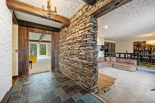 167 Arline Dr, Waterbury, CT 06705 - entryway featuring a chandelier, baseboards, stone tile floors, beam ceiling, and a textured ceiling