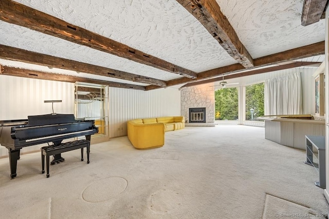 living area featuring a fireplace, carpet, and beam ceiling