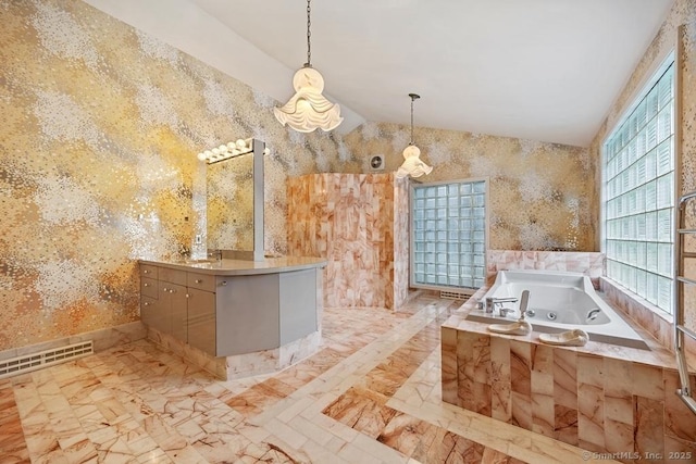 bathroom with marble finish floor, lofted ceiling, a tub with jets, and visible vents