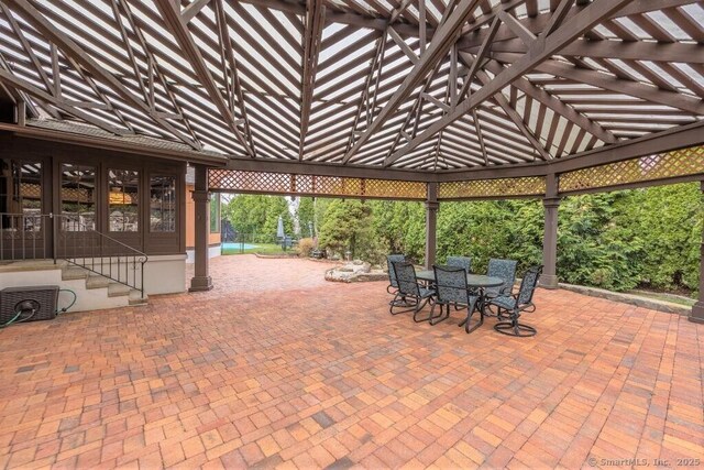 view of patio with french doors and outdoor dining space