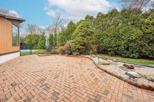 view of patio with fence