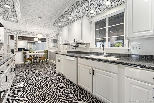 167 Arline Dr, Waterbury, CT 06705 - kitchen featuring a sink, white dishwasher, white cabinetry, dark countertops, and dark carpet