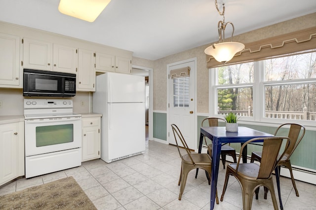 kitchen with decorative light fixtures, white cabinetry, white appliances, and light countertops