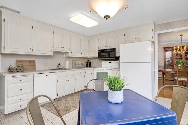kitchen featuring white cabinetry, white appliances, light countertops, and a sink