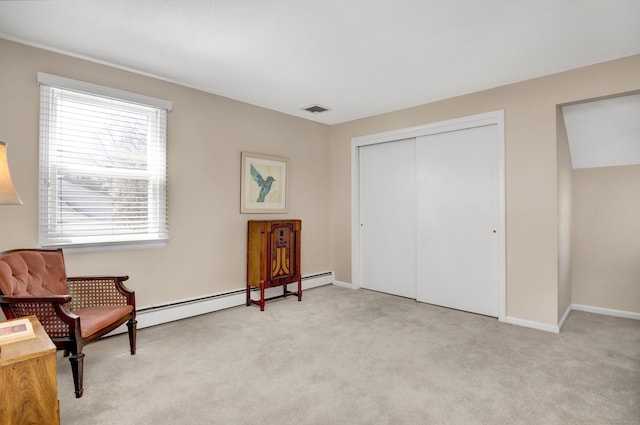 sitting room with visible vents, carpet flooring, and baseboards