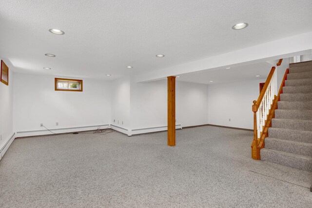 below grade area featuring recessed lighting, stairs, and carpet floors