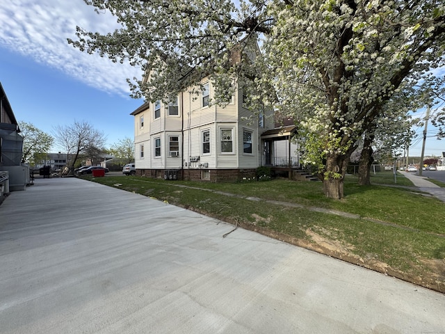 15 Eaton St, Hartford, CT 06114 - view of home's exterior with a yard