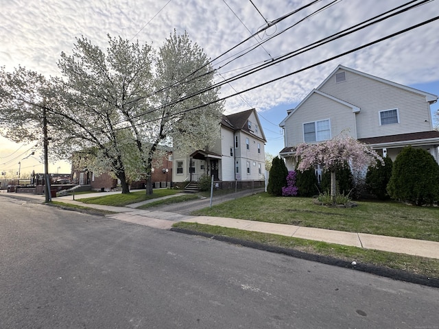15 Eaton St, Hartford, CT 06114 - view of front of property featuring a front yard