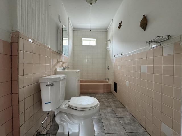 15 Eaton St, Hartford, CT 06114 - bathroom with tile walls, tile patterned flooring, toilet, shower / tub combination, and a sink