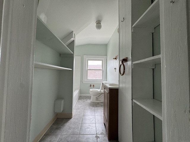 15 Eaton St, Hartford, CT 06114 - bathroom featuring tile patterned flooring, vanity, toilet, baseboards, and lofted ceiling