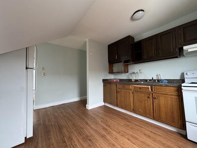 15 Eaton St, Hartford, CT 06114 - kitchen with white appliances, a sink, dark wood-style flooring, vaulted ceiling, and baseboards