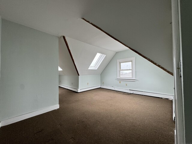 15 Eaton St, Hartford, CT 06114 - bonus room featuring a skylight, dark colored carpet, vaulted ceiling, and baseboards