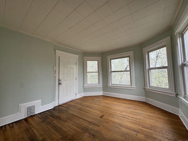 15 Eaton St, Hartford, CT 06114 - entryway featuring dark wood finished floors, baseboards, and ornamental molding