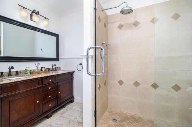 bathroom with a sink and a tile shower