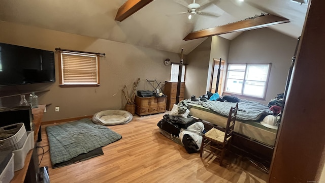 bedroom featuring baseboards, wood finished floors, and vaulted ceiling with beams