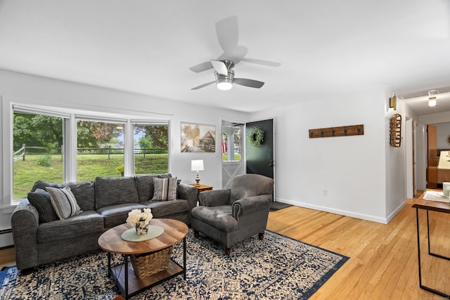 52 Pine Orchard Rd, Branford, CT 06405 - living area featuring light wood finished floors, baseboards, a ceiling fan, and a baseboard heating unit