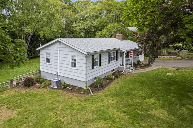 52 Pine Orchard Rd, Branford, CT 06405 - view of home's exterior with roof with shingles, a chimney, and central AC