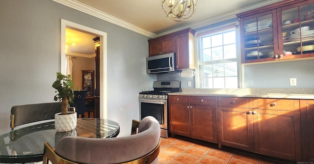 97 Waterbury Ave, Stamford, CT 06902 - kitchen with appliances with stainless steel finishes, crown molding, light tile patterned floors, and a chandelier